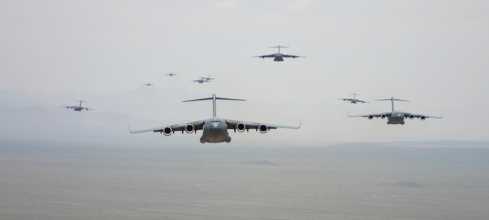 NELLIS AIR FORCE BASE, Nev.--C-17A Globemaster III’s prepare for an airdrop over the Nevada Test Range during the U.S. Air Force Weapons School Mobility Air Forces Exercise here May 9. The Weapons School holds MAFEX twice a year to test the ability of C-17A Globemaster III and C-130 Hercules aircrews from 12 Air Force bases around the world to join together in a formation at a specific time and location to insert ground forces anywhere in the world. Thirteen C-17s and 15 C-130s took part in the MAFEX. (U.S. Air Force photo/Senior Airman Danielle Johnson)