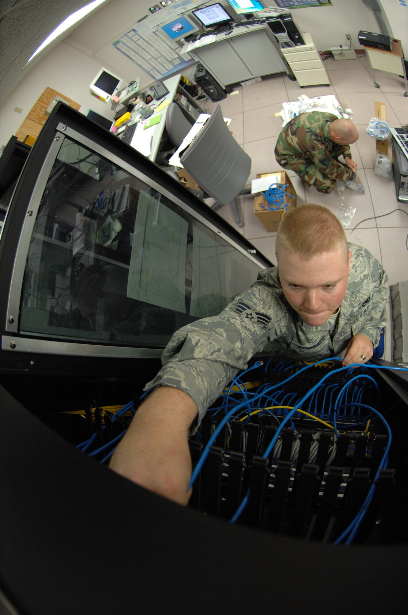 Senior Airman Etheridge, traces and plugs Cat-5 cable to the existing patch panel at Holloman Air Force Base, N.M. May 05. SrA Etheridge is an infrastructure technician assigned to the 49th Communications Squadron.
(U.S. Air Force photo/ Senior Airman Anthony Nelson Jr)  
