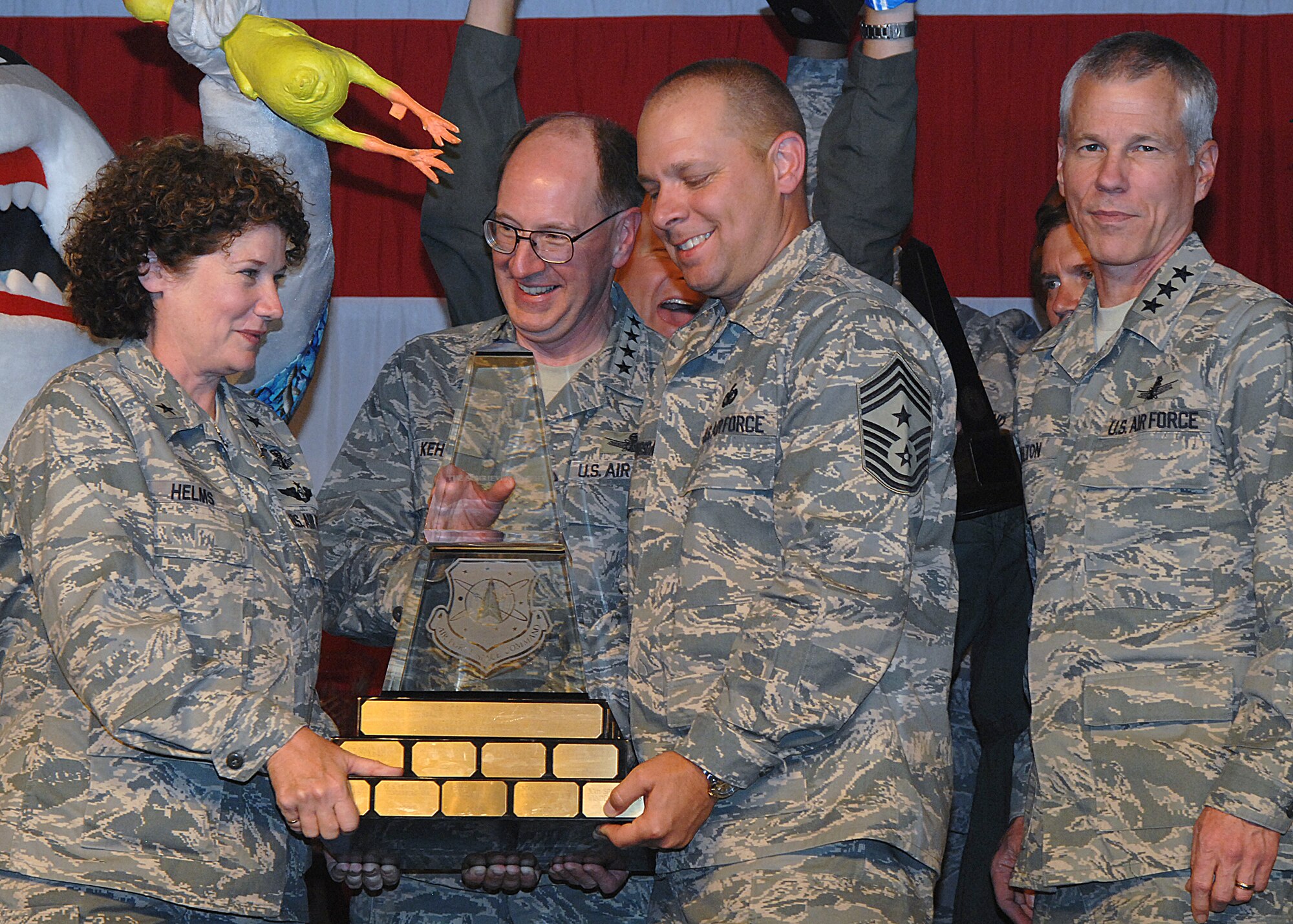 Members of the Guardian Challenge team from 45th Space Wing at Patrick Air Force Base, Fla., celebrate their Schriever Trophy win May 9 naming them the Best Space Launch Wing in Air Force Space Command.  Guardian Challenge is the Air Force's premier space and missile competition.  The award presentation took place at Peterson AFB, Colo.  (U.S. Air Force photo/Duncan Wood)