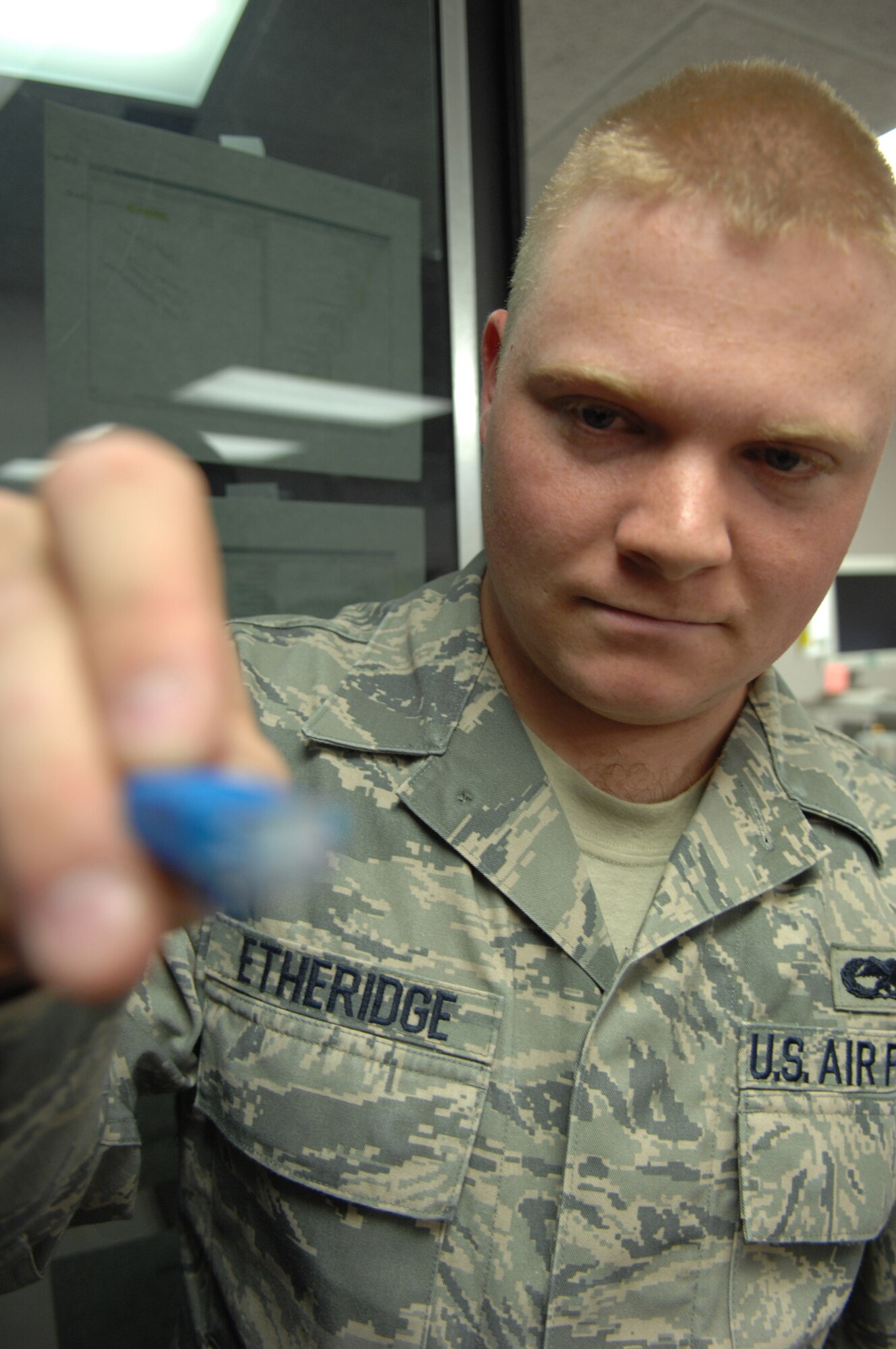 Senior Airman Etheridge, shows the existing Cat-5 cable from a patch panel at Holloman Air Force Base, N.M. May 05. SrA Etheridge is an infrastructure technician assigned to the 49th Communications Squadron.
(U.S. Air Force photo/ Senior Airman Anthony Nelson Jr)  
