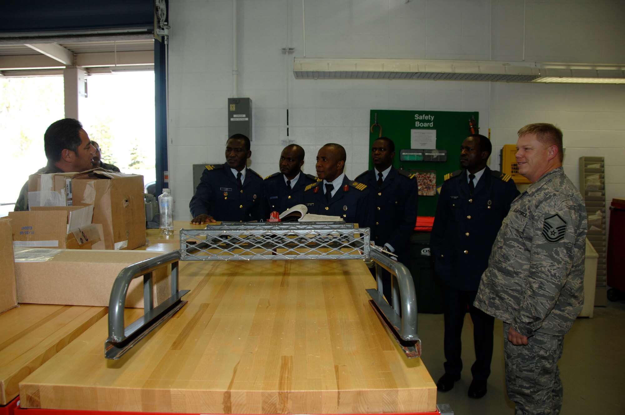 Group Captain Son Igwe, along with members of the Nigerian Air Force, met and toured with 129th Maintenance Group personnel during their visit to the 129th Rescue Wing, Moffett FAF, California Air National Guard. (U.S. Air Force photo/Master Sgt. Dan Kacir)