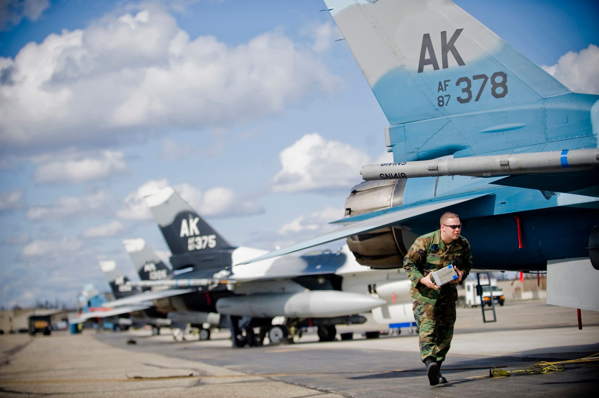 Airman Brad Ivey, 354th Aircraft Maintenance Squadron crew chief, removes chaff from an 18th Aggressor Squadron F-16 at Eielson Air Force Base, Alaska on May 8, 2008. The 18th Aggressor Squadron is participating in Northern Edge, simulating enemy aircraft from various countries in order to allow joint forces to train for world wide crises. (U.S. Air Force Photo by Airman 1st Class Jonathan Steffen) (RELEASED)