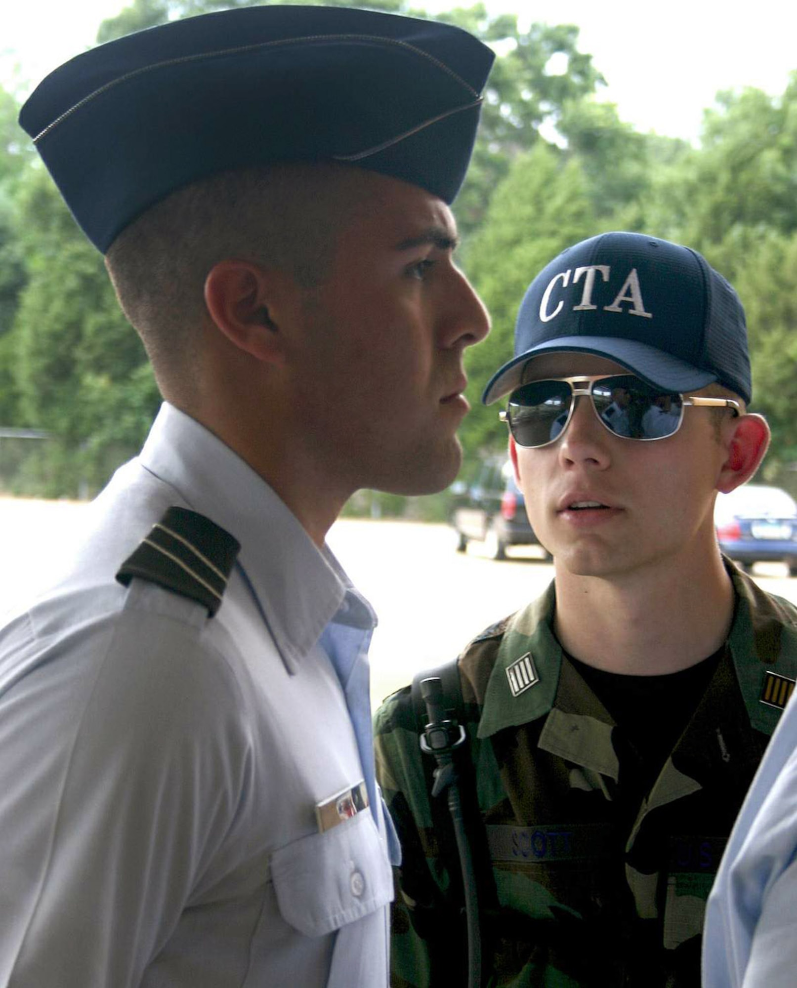 Cadet Gregory Scott (right) corrects a cadet during field training initial in-processing May 8 at Maxwell Air Force Base, Ala. More than 360 ROTC cadets, mostly rising juniors from 144 colleges nationwide, started off the first class of summer field training. Cadet Scott is a ROTC cadet training assistant from Utah's Brigham Young University. (U.S. Air Force photo/Staff Sgt. Jason Lake)
