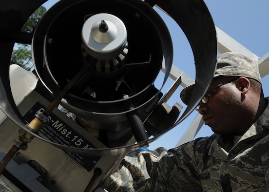 MOODY AIR FORCE BASE, Ga. -- Staff Sgt. Richard Mauldin, 23rd Civil Engineer Squadron entomologist, turns on a truck-mounted mosquito fogger here May 12. The mosquito fogger sprays out a pesticide called scourge, which kills adult mosquitoes on contact. (U.S. Air Force photo by Airman 1st Class Brittany Barker) 

