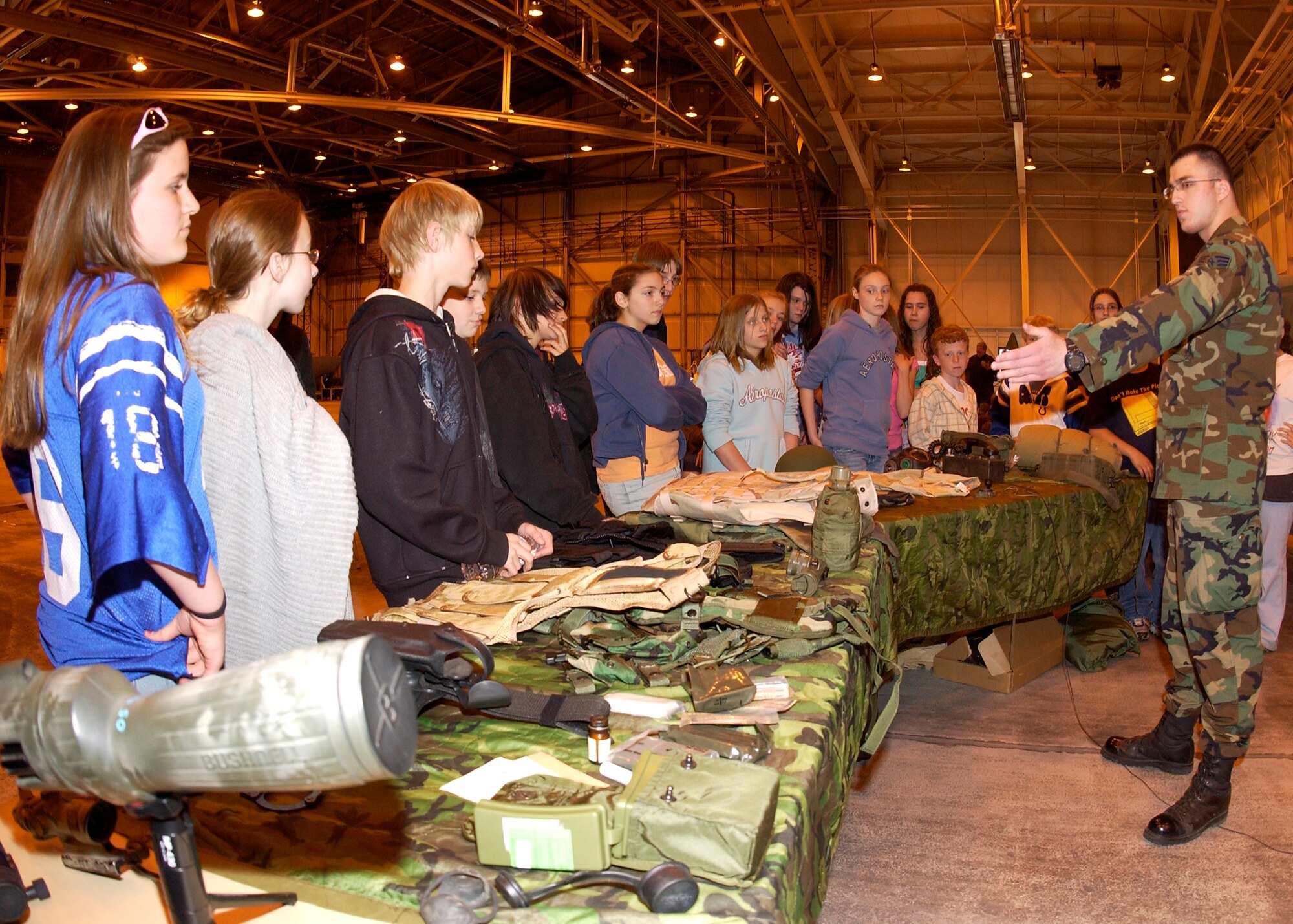 GRISSOM AIR RESERVE BASE, Ind., -- Senior Airman Ellis Owens, a fire team member with the 434th Security Forces Squadron, shares information about military equipment with Miami County sixth graders. Approximately 460 students visited Grissom to participate in a National Police Week event. Grissom has been hosting the event for more than 15 years. (U.S. Air Force photo/Tech. Sgt. Doug Hays)                