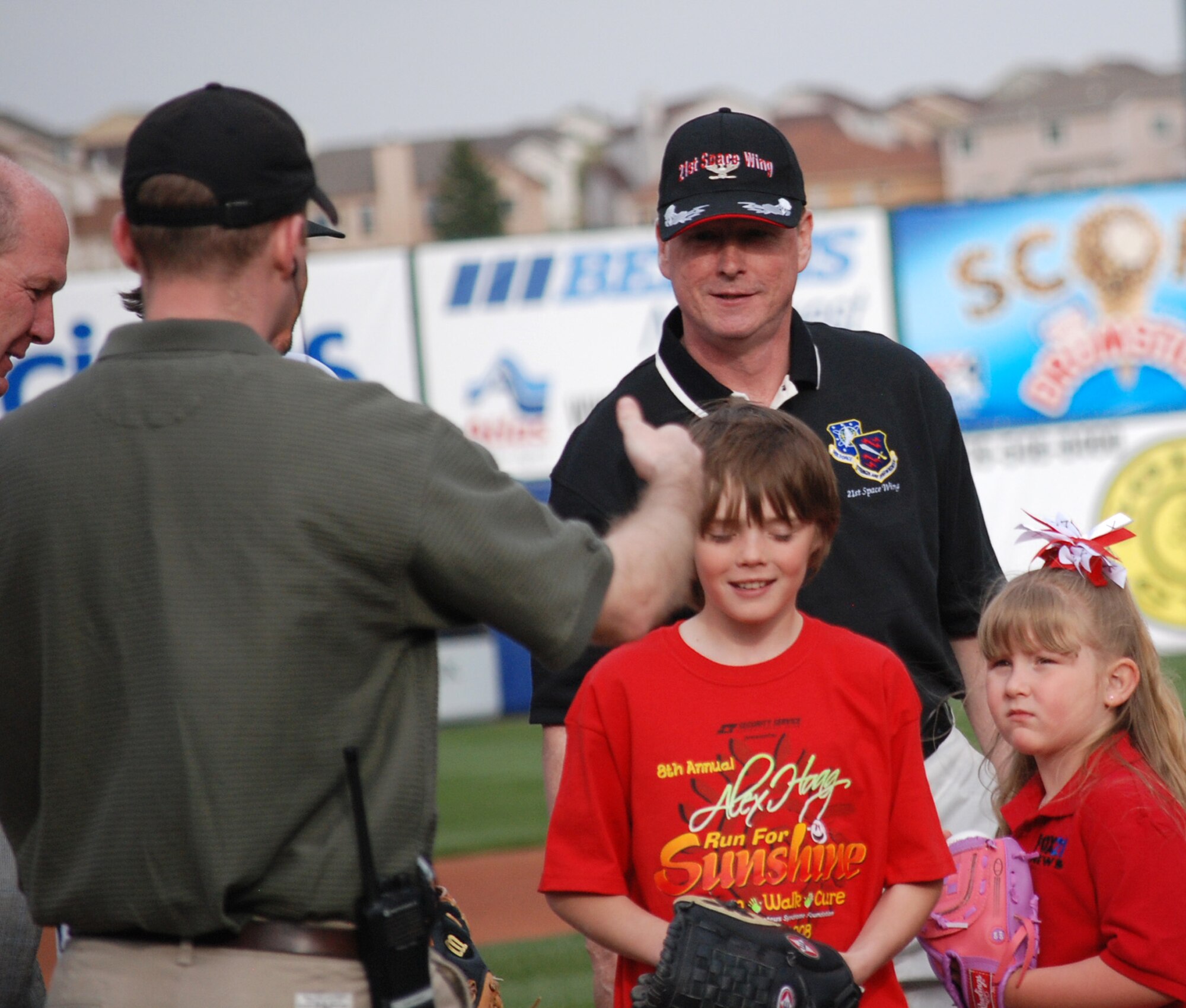 Col. Scott Shepherd, 21st Space Wing vice commander, thanks Sky Sox administrators at the game May 9. Colonel Shepherd and leadership from other Front Range bases threw out the ceremonial first pitches in honor of military appreciation night at the stadium. (U.S. Air Force photo/Staff Sgt. Jessica Switzer)