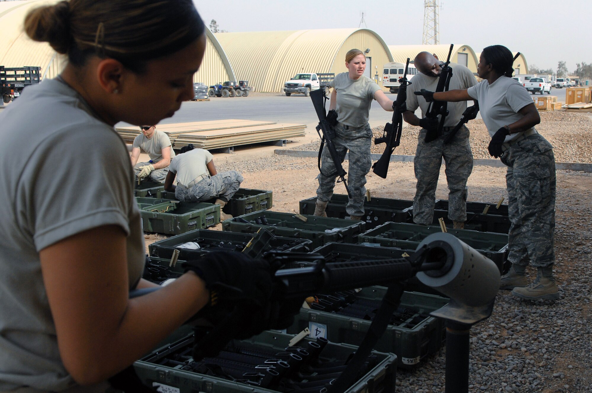 Airmen from the 332nd Expeditionary Logistics Readiness Squadron base supply shop check serial numbers and clear M-16 rifles before placing the weapons in the armory April 5 at Balad Air Base, Iraq. Balad AB has been chosen by Air Force leaders to be the test base for a weapons prepositioning initiative expected to save the Air Force approximately $1.3 million per year in transportation costs. (U.S. Air Force photo/Senior Airman Julianne Showalter) 
