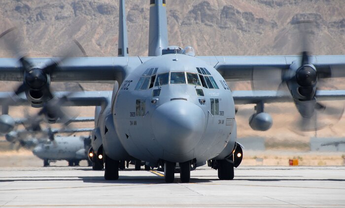 NELLIS AIR FORCE BASE, Nev.—C-130 Hercules’ from units worldwide taxi during the U.S. Air Force Weapons School Mobility Air Forces Exercise here May 9. The Weapons School holds MAFEX twice a year to test the ability of C-17A Globemaster III and C-130 Hercules aircrews from 12 Air Force bases around the world to join together in a formation at a specific time and location to insert ground forces anywhere in the world. (U.S. Air Force photo/Chief Master Sgt. Gary Emery)