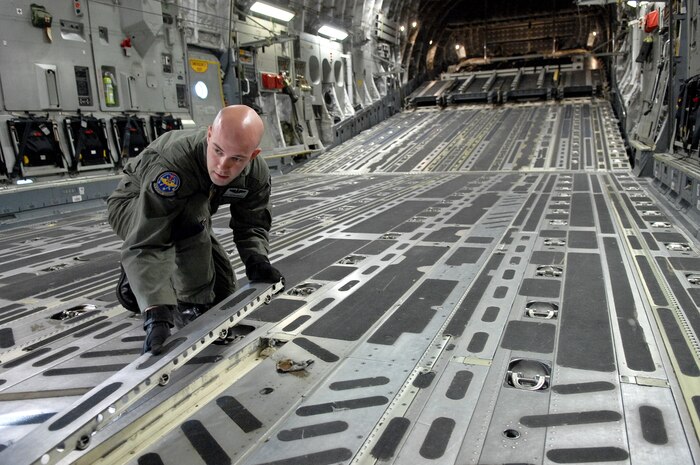 NELLIS AIR FORCE BASE, Nev.--Tech. Sgt. Bryan Marvel, 57th Weapons Squadron, McGuire AFB, N.J., prepares a C-17 Globemaster III for a mission during the U.S. Air Force Weapons School Mobility Air Forces Exercise here May 9. The Weapons School holds MAFEX twice a year to test the ability of C-17A Globemaster III and C-130 Hercules aircrews from 12 Air Force bases around the world to join together in a formation at a specific time and location to insert ground forces anywhere in the world. (U.S. Air Force photo/Master Sgt. Robert W. Valenca)