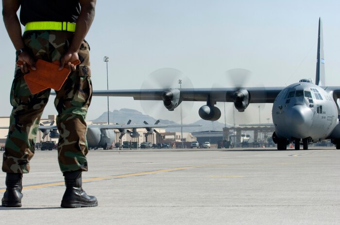 NELLIS AIR FORCE BASE, Nev.—Tech. Sgt. Louis Marcy, a C-130 Hercules crew chief assigned to the 314th Aircraft Maintenance Squadron, Little Rock AFB, Ark., prepares to taxi a C-130 Hercules for a training mission during the U.S. Air Force Weapons School Mobility Air Forces Exercise here May 9. The Weapons School holds MAFEX twice a year to test the ability of C-17A Globemaster III and C-130 Hercules aircrews from 12 Air Force bases around the world to join together in a formation at a specific time and location to insert ground forces anywhere in the world. (U.S. Air Force photo/Senior Airman Larry E. Reid Jr.)
