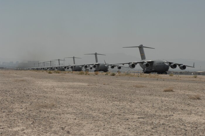 NELLIS AIR FORCE BASE, Nev.--C-17 Globemaster III’s and C-130 Hercules’ arrive for the U.S. Air Force Weapons School Mobility Air Forces Exercise here May 9. The Weapons School holds MAFEX twice a year to test the ability of C-17A Globemaster III and C-130 Hercules aircrews from 12 Air Force bases around the world to join together in a formation at a specific time and location to insert ground forces anywhere in the world. (U.S. Air Force photo/Senior Airman Nadine Y. Barclay)