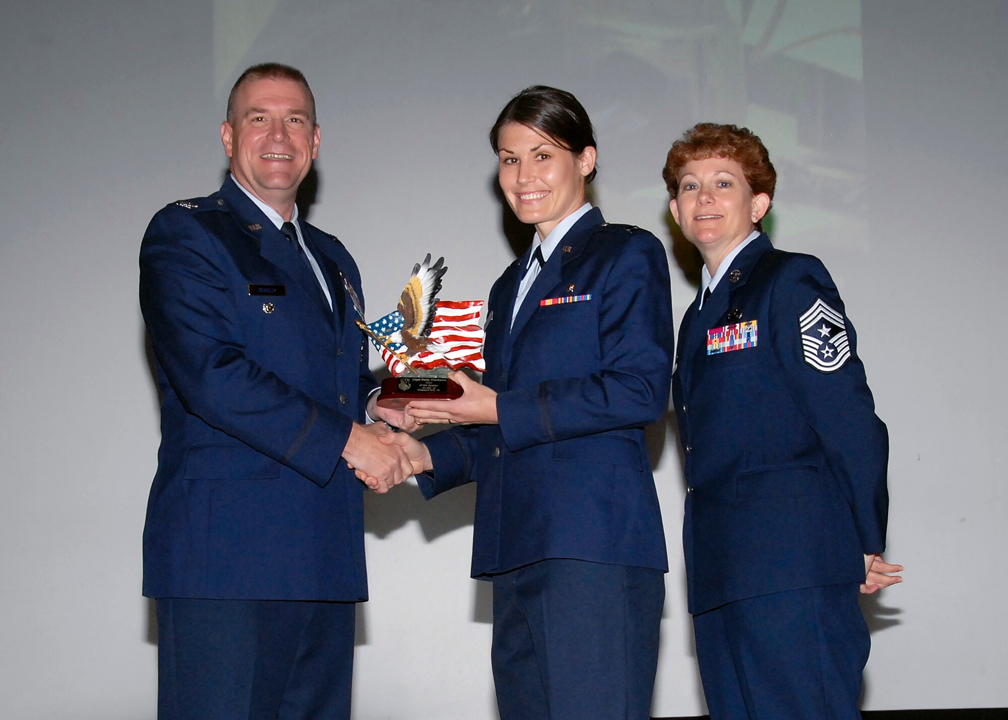 Col, Kris Beasley, 82nd Training Wing vice commander, presents Capt. Kelly Clarkson, 82nd Mission Support Group, with the Company Grade Officer of the Quarter, award May 6. (U.S. Air Force photo/Mike Litteken)