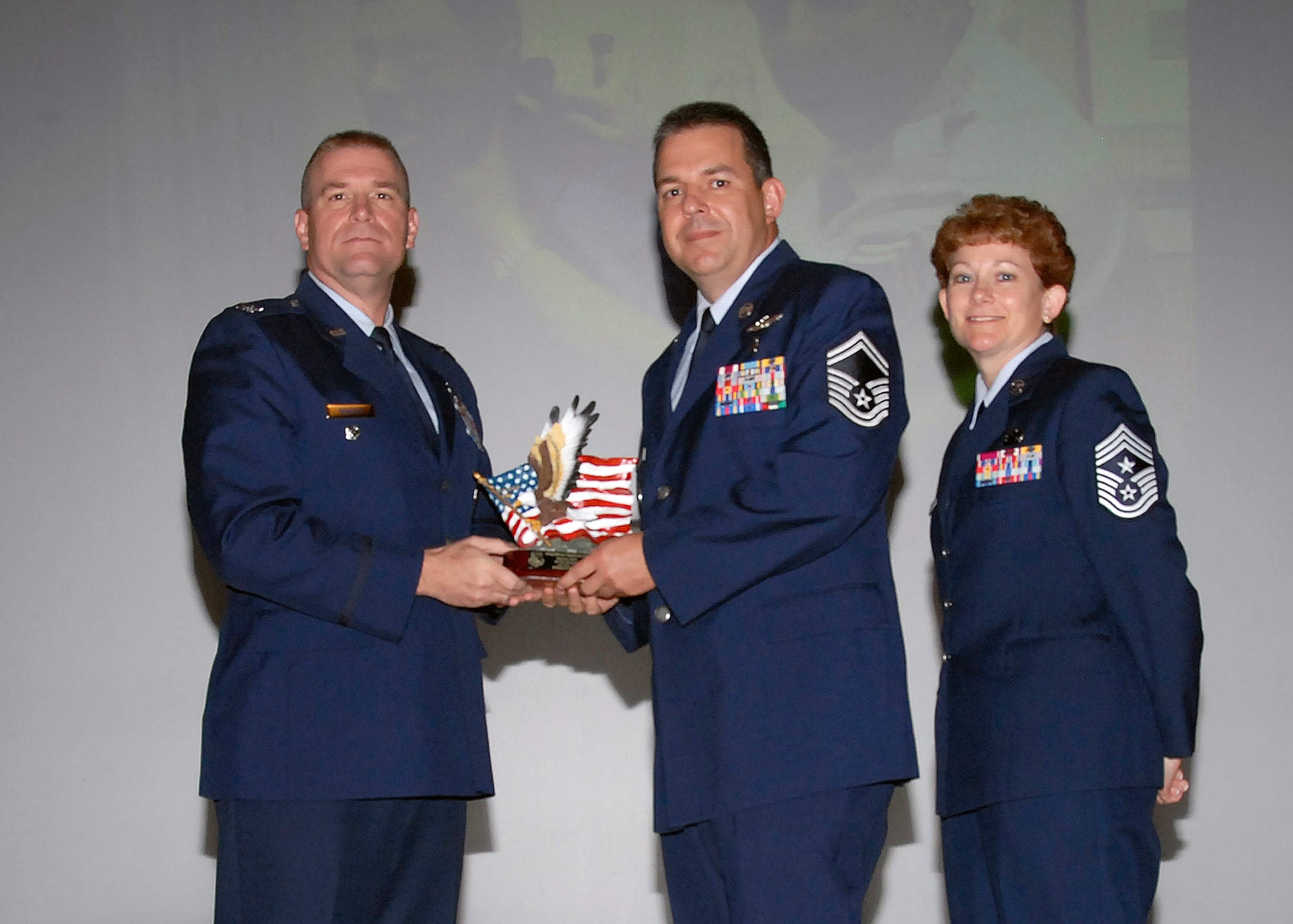 Col, Kris Beasley, 82nd Training Wing vice commander, presents Senior Master Sgt. Michael Stephenson-Pino, 882nd Training Group, with the Senior NCO of the Quarter, award May 6. (U.S. Air Force photo/Mike Litteken)