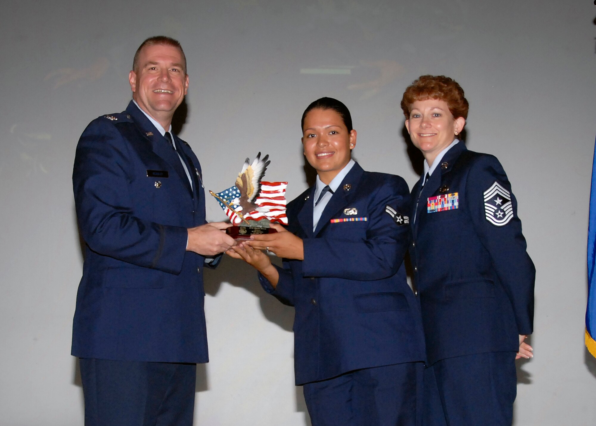 Col, Kris Beasley, 82nd Training Wing vice commander, presents Airman 1st Class Maria Mena, 82nd Training Wing, with the Airman of the Quarter, award May 6. (U.S. Air Force photo/Mike Litteken)