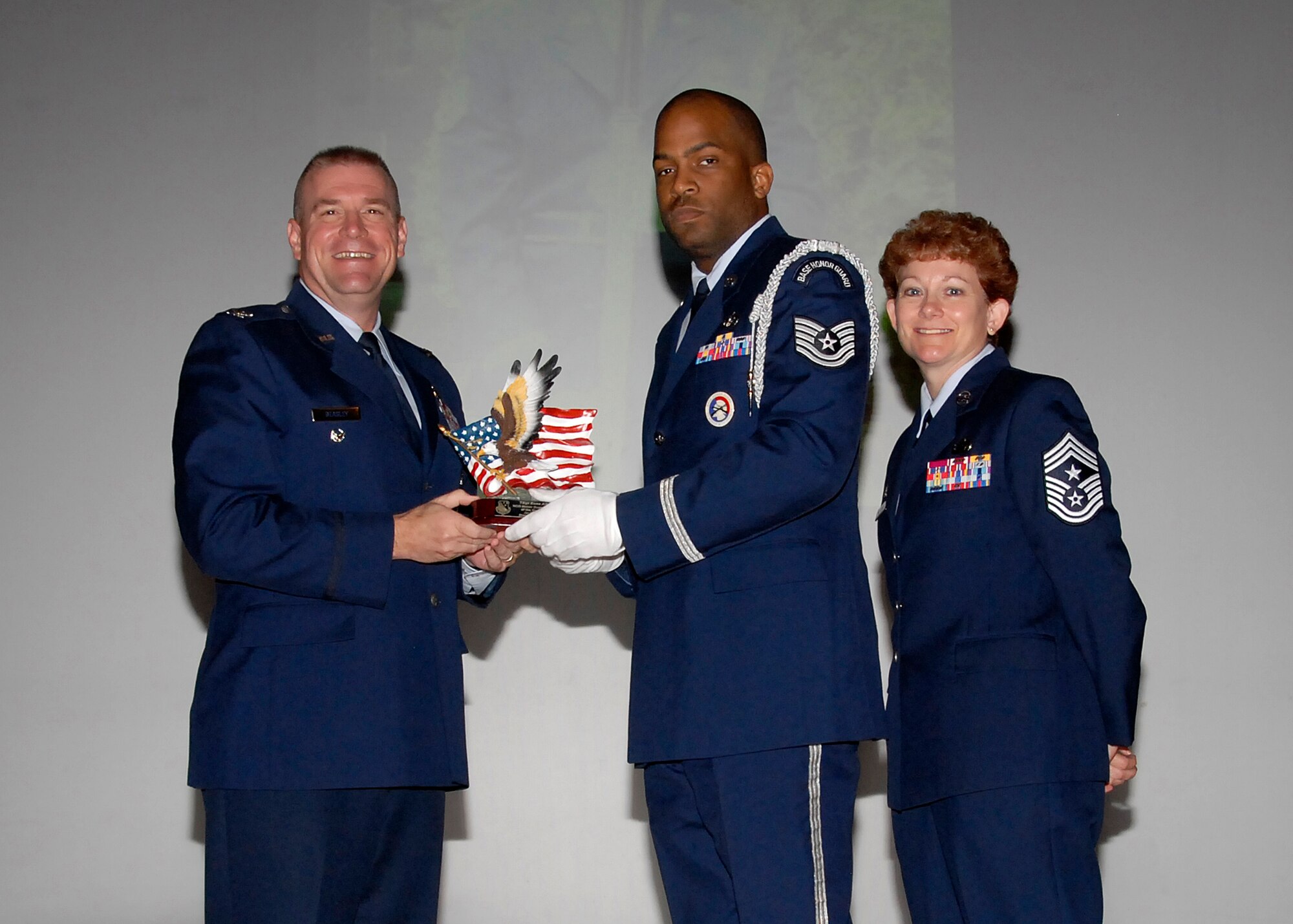 Col, Kris Beasley, 82nd Training Wing vice commander, presents Tech. Sgt. Esaa  Ali, 782nd Training Group, with the NCO Honor Guardsmen of the Quarter, award May 6. (U.S. Air Force photo/Mike Litteken)