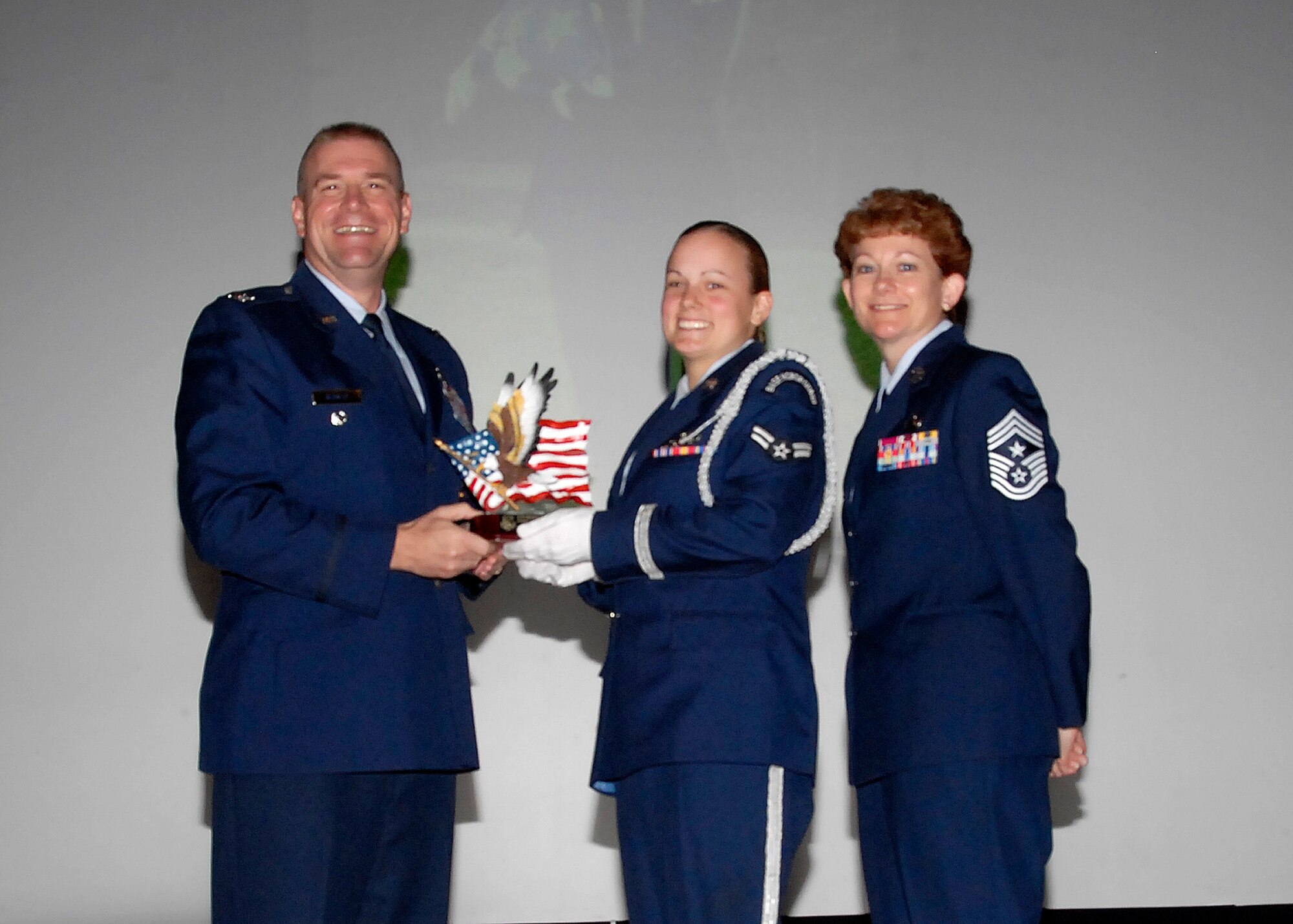 Col, Kris Beasley, 82nd Training Wing vice commander, presents Airman 1st Class Siobhan Murphy, 80th Flying Training Wing, with the Airman Honor Guardsmen of the Quarter, award May 6. (U.S. Air Force photo/Mike Litteken)