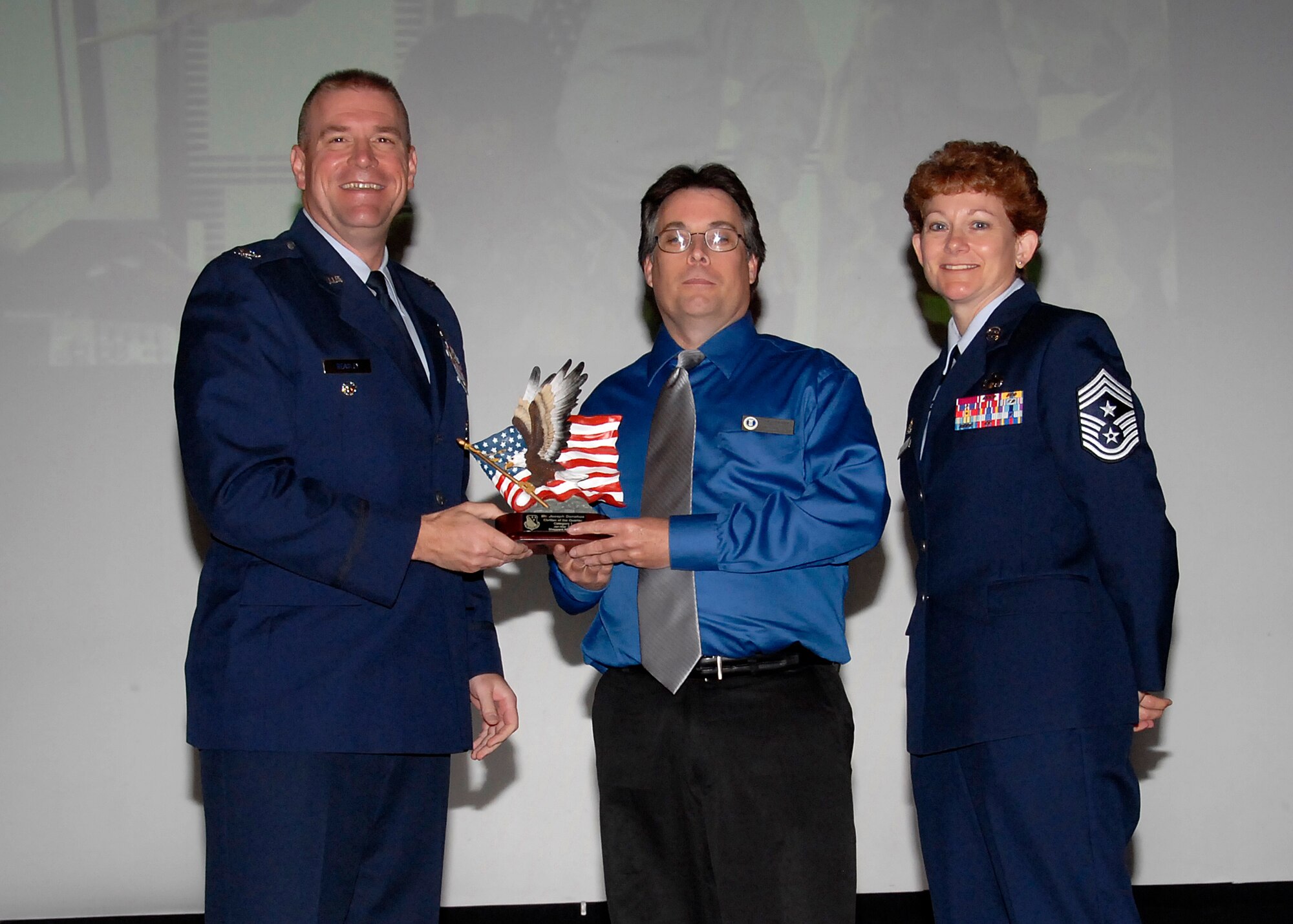 Col, Kris Beasley, 82nd Training Wing vice commander, presents Joseph Donahue, 82nd Training Wing, with the Civilian of the Quarter, category I, award May 6. (U.S. Air Force photo/Mike Litteken)