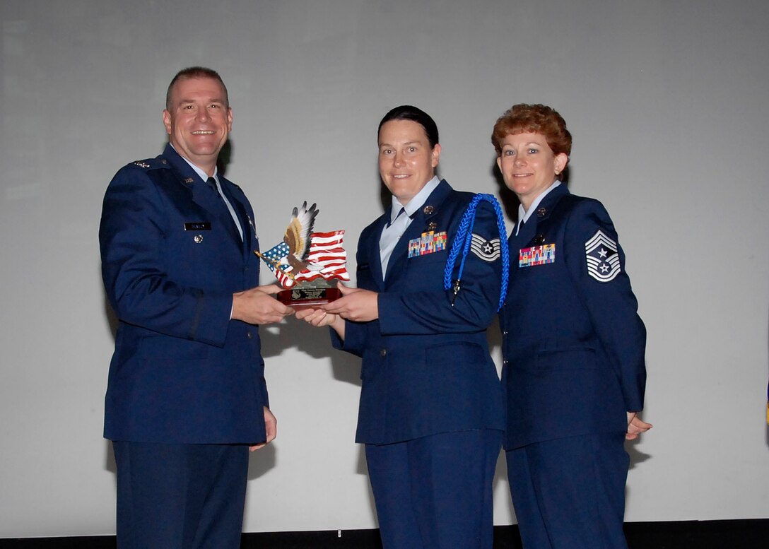 Col, Kris Beasley, 82nd Training Wing vice commander, presents Tech. Sgt. Tammy Boedges, 82nd Training Group, with the Military Volunteer of the Quarter award May 6. (U.S. Air Force photo/Mike Litteken)