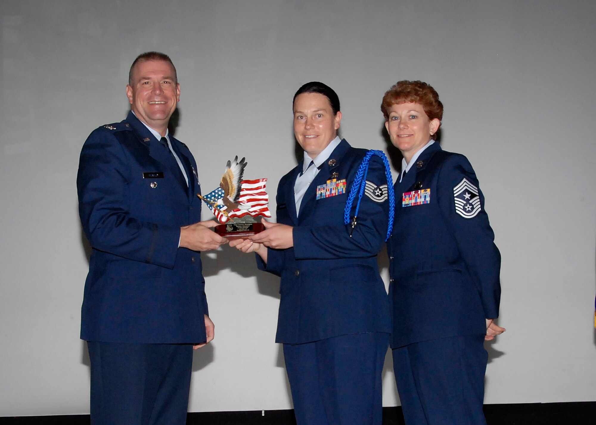Col, Kris Beasley, 82nd Training Wing vice commander, presents Tech. Sgt. Tammy Boedges, 82nd Training Group, with the Military Volunteer of the Quarter award May 6. (U.S. Air Force photo/Mike Litteken)
