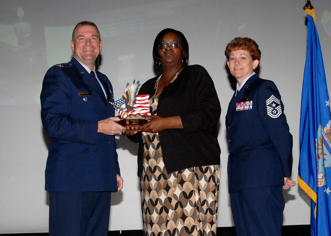 Col, Kris Beasley, 82nd Training Wing vice commander, presents Valerie Berry, 82nd Training Group, with the Civilian Volunteer of the Quarter award May 6. (U.S. Air Force photo/Mike Litteken)