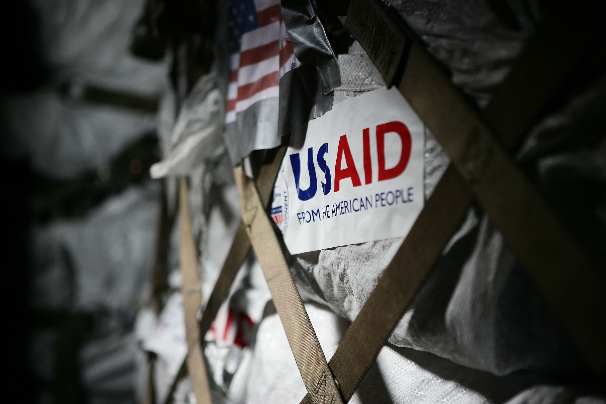 Supplies from the U.S. Agency for International Development from the American People is loaded into a C-130 Hercules for to the country of Burma May 12 at the Yangon International Airport. The plane carried water, food and medical supplies to provide relief to Burma, which was struck by Cyclone Nargis May 28. (U.S. Marine Corps photo/Sgt. Andres Alcaraz)