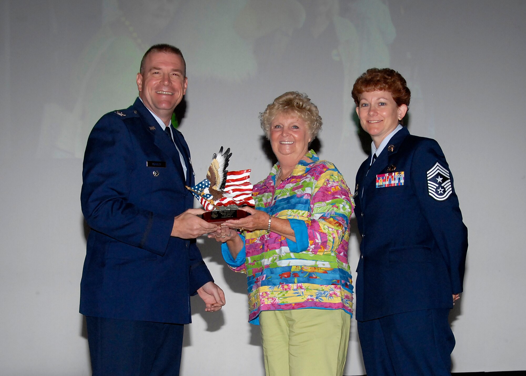 Col, Kris Beasley, 82nd Training Wing vice commander, presents Carolyn Neal, 82nd Mission Support Group, with the Spouse Volunteer of the Quarter award May 6. (U.S. Air Force photo/Mike Litteken)