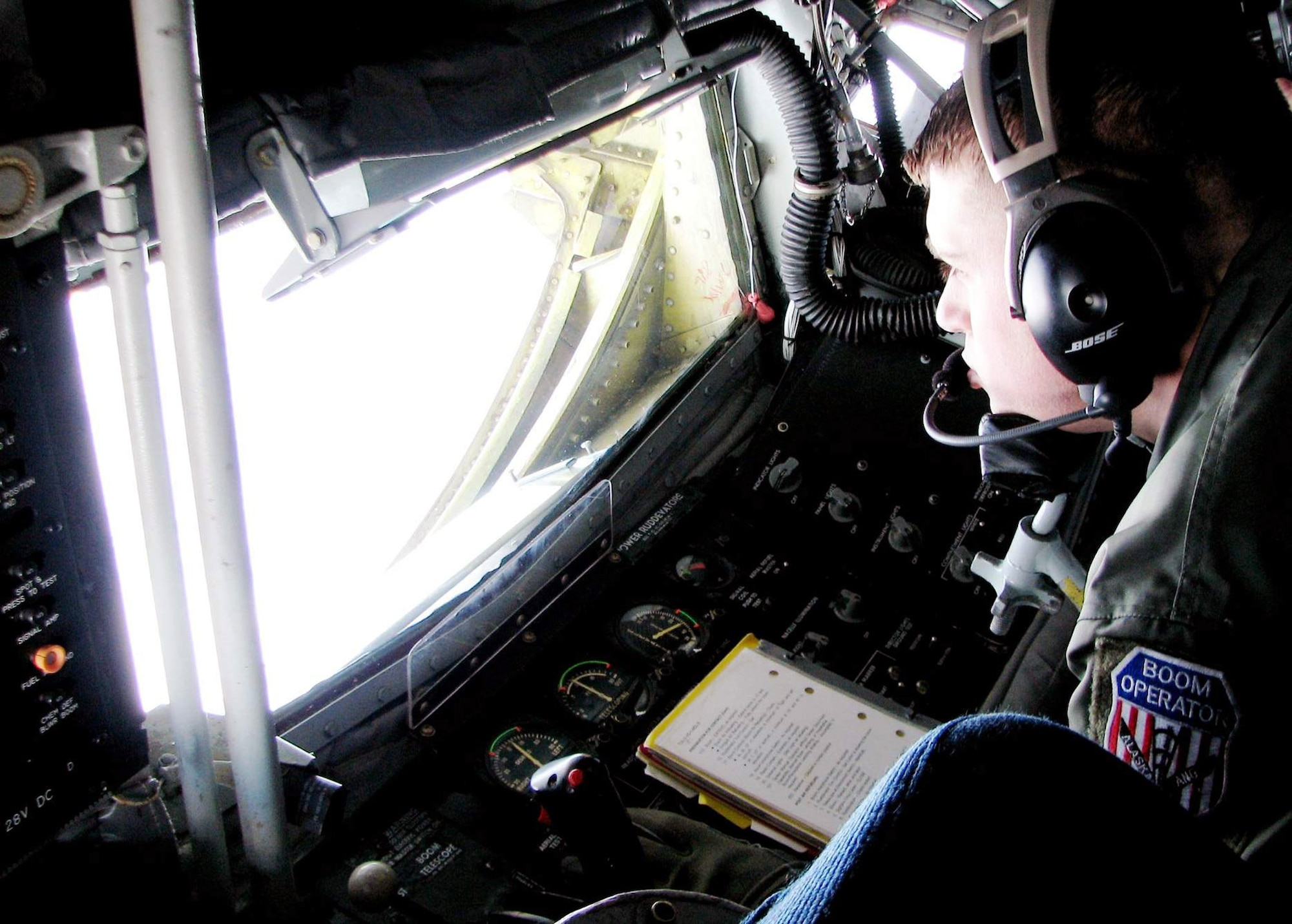 Staff Sgt. Christian Willey handles the controls during a  KC-135 Stratotanker aerial-refueling mission May 8 over Alaska. The flight was part of Northern Edge 2008, the largest military training exercise in Alaska, which began May 5 and concludes May 16. The Alaska Air National Guard's 168th Air Refueling Wing at Eielson Air Force Base, Alaska, performs daily refueling flights as part of the exercise. Sergeant Willey is a 168th ARW KC-135 boom operator. (U.S. Air Force photo/Tech. Sgt. Mikal Canfield) 