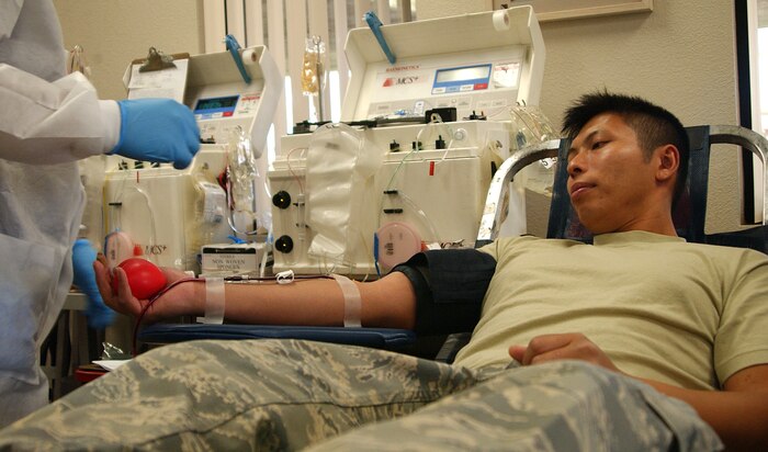 NELLIS AIR FORCE BASE, Nev.—Senior Airman Rattanak Nhok donates blood during the 57th Wing’s May blood drive held at the Outdoor Recreation Center here May 9. More than 75 Airmen contributed to this month’s blood drive, hosted by United Blood Services, bringing in more than 75 units of blood. (U.S. Air Force photo/Staff Sgt. Jacob R. McCarthy)