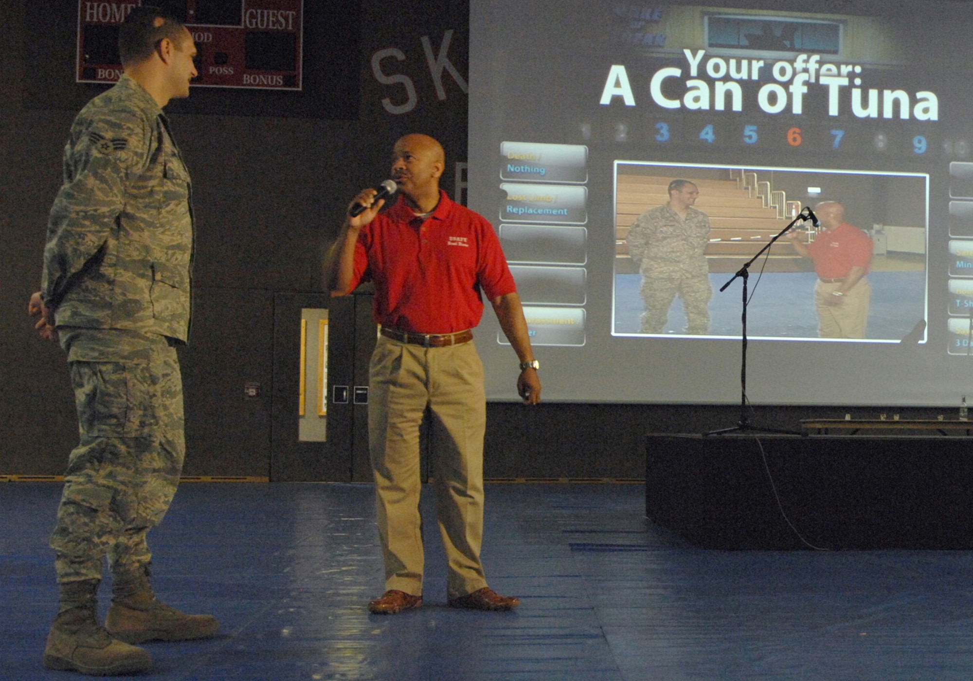 SPANGDAHLEM AIR BASE, Germany--The USAFE Safety roadshow stopped at Spangdahlem AB, Germany on April 12, 2008.  Chief Master Sgt. Burroell Hancock hosts Make or Break, a game illustrating the importance of responsible choices. The game is based on Deal or No Deal which required Senior Airman Jarrod Garceau, a contestant,  to decide which case to pick. 
U.S. Air Force Photo by Staff Sgt. Heather M. Norris
