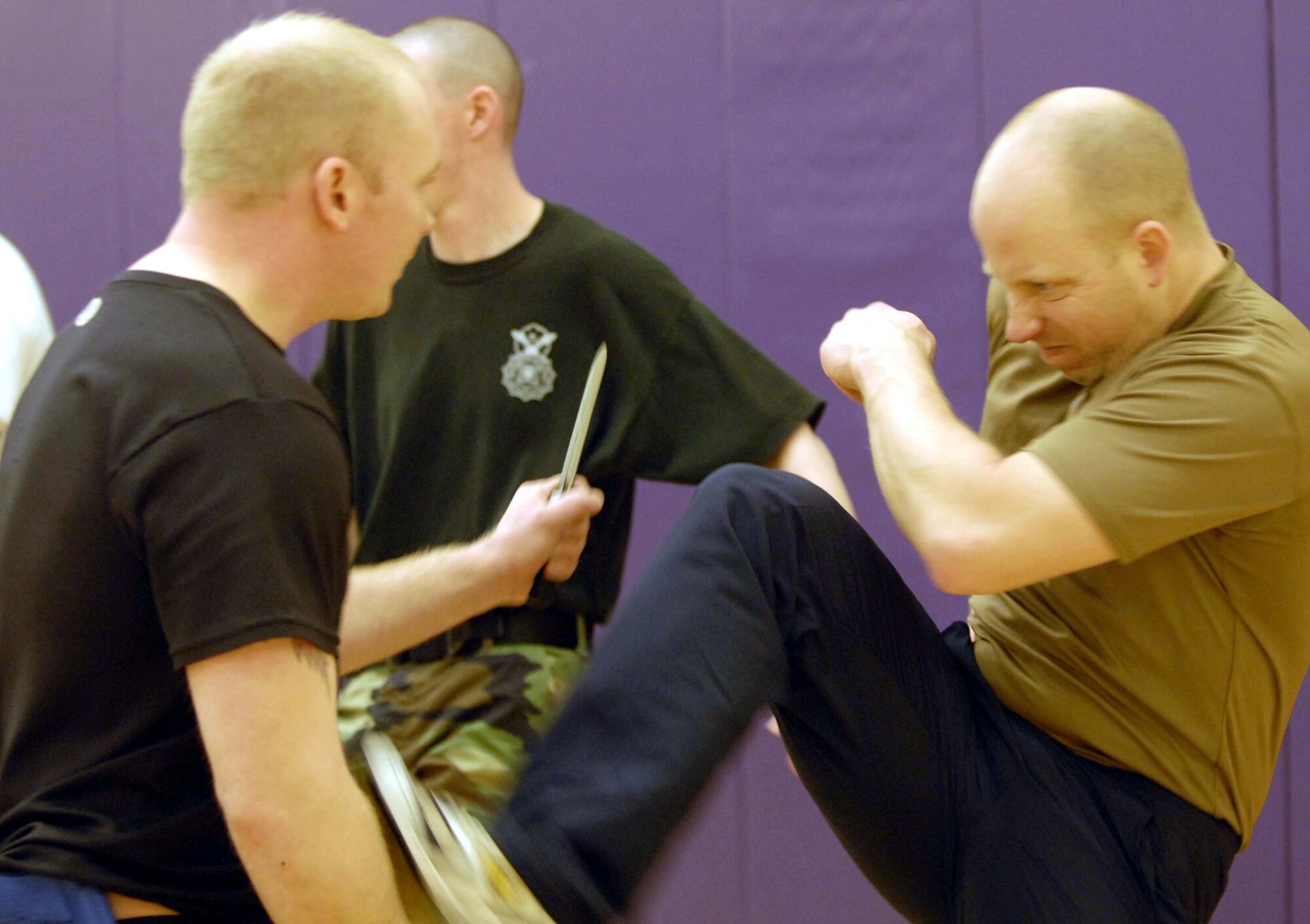 Master Sgt. Ted Hemmah, left, and Master Sgt. Mike Bier, 934th Security Forces Squadron, practice moves during a Krav Maga class at the 934th Fitness Center. Air Force photo/Master. Sgt. Paul Zadach.