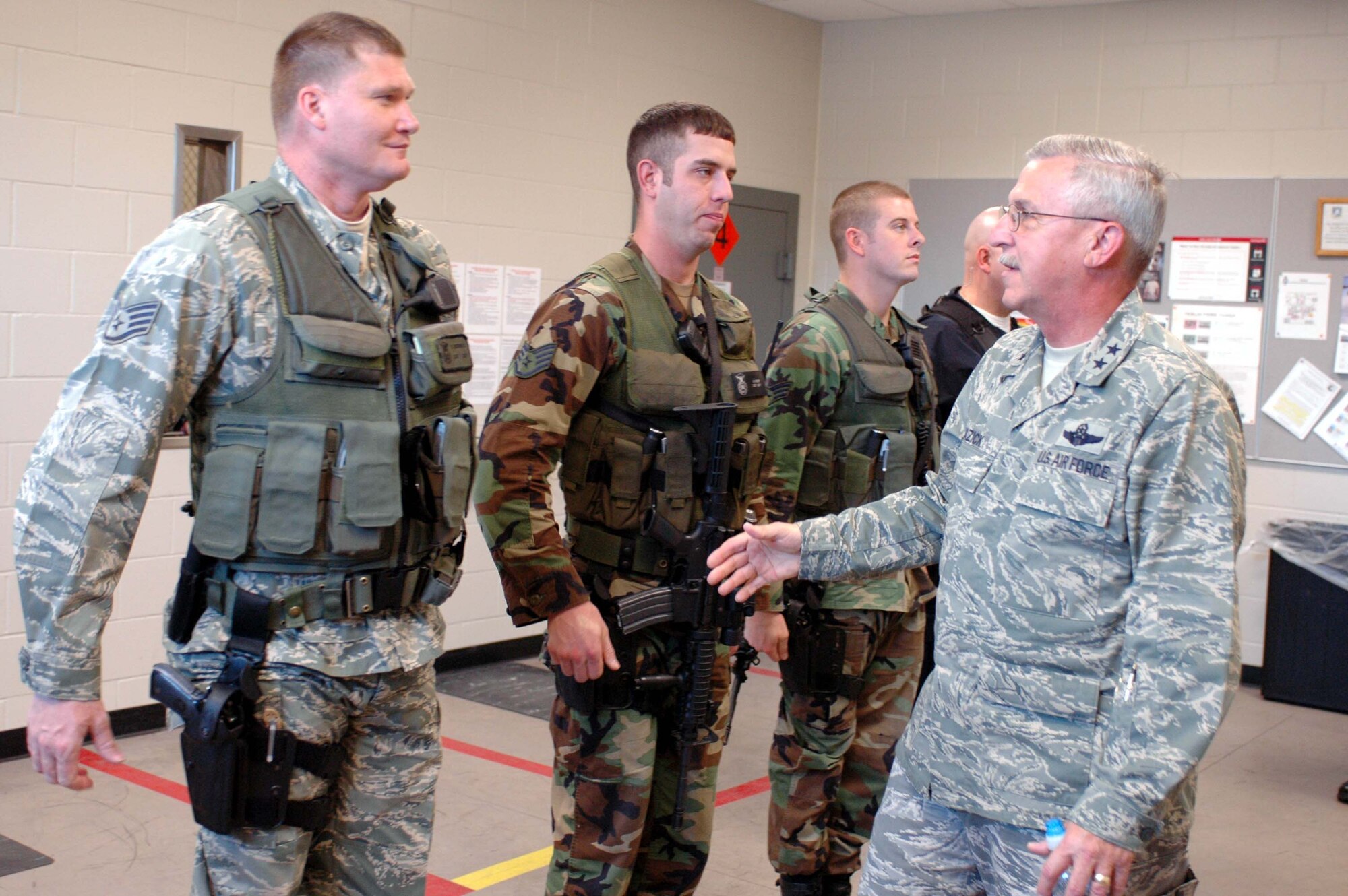 Maj. Gen. Martin Mazick, 22d Air Force commander, talks with (l to r) Staff Sgts. Robert McDonald, Matt Roder and Senior Airman Luke Moran, 934th Security Forces, during B shift Guardmount.  General Mazick visited 934th Airmen during the May UTA and presented the Outstanding Unit Award to the Wing.
Air Force Photo/Tech. Sgt. Bob Sommer

 
