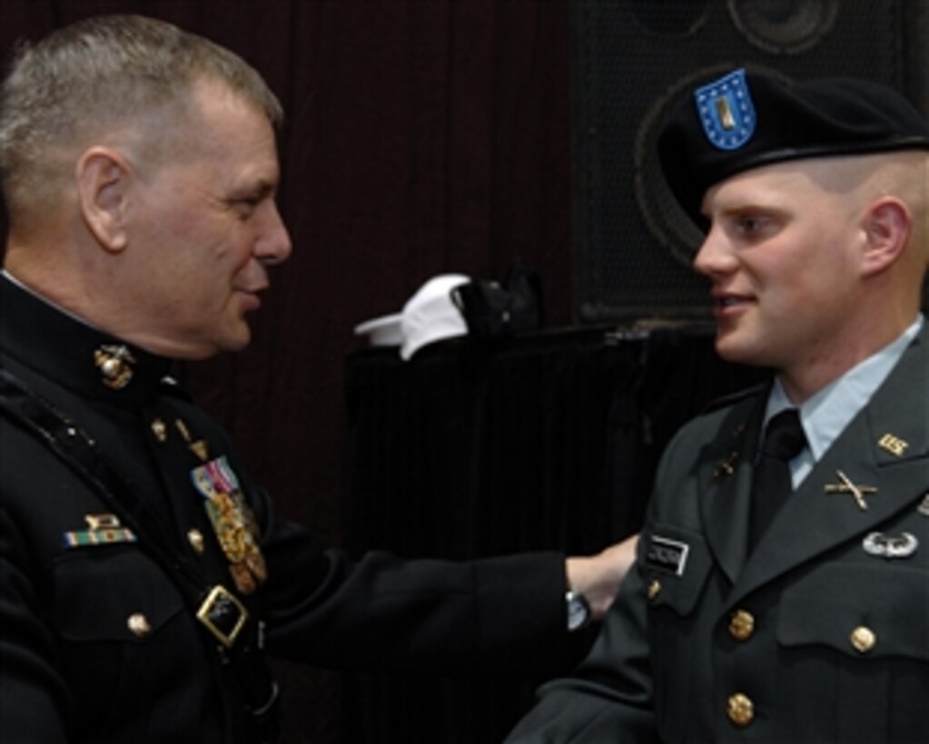 Vice Chairman of the Joint Chiefs of Staff Marine Gen. James Cartwright congratulates Army 2nd Lt. Paul Corcoran after the Norwich University graduation ceremony in Northfield, Vt., May 10, 2008. Cartwright administered the oath of office to more than 100 newly commissioned officers. 