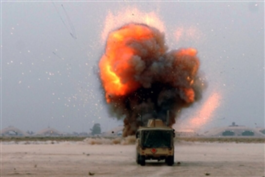 A fire ball explodes from a crater during a controlled detonation on Balad Air Base, Iraq, May 9, 2008. U.S. Airmen from the 332nd Expeditionary Civil Engineer Squadron explosive ordnance disposal team conducted the detonation to dispose of unexploded ordnances to ensure they cannot be used by enemy forces. 