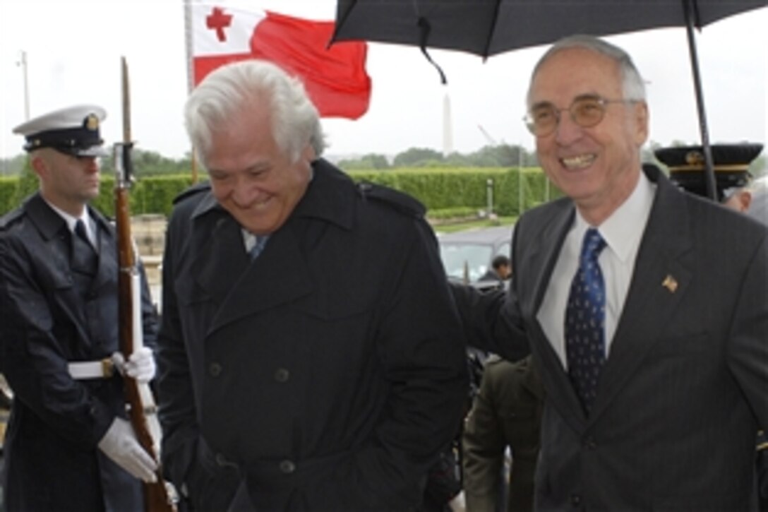 U.S. Deputy Defense Secretary Gordon England, right, escorts Tongan Prime Minister Feleti Sevele through an honor cordon into the Pentagon to conduct a closed-door meeting, May 12, 2008.  