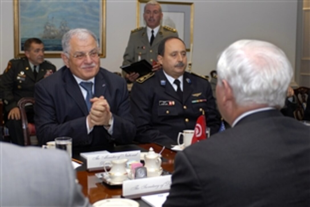 Tunisian National Defense Minister Kamel Morjane, left, meets with U.S. Defense Secretary Robert M. Gates, right foreground, in the Pentagon, May 12, 2008, during a luncheon to discuss bilateral defense issues.  