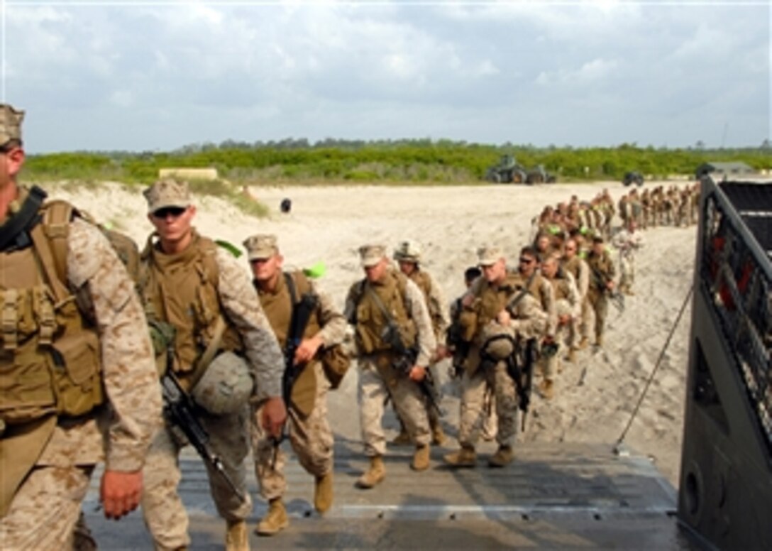 U.S. Marines assigned to the 26th Marine Expeditionary Unit embark a landing craft air cushion from Assault Craft Unit 4 at Camp Lejeune, N.C., for transport to the amphibious assault ship USS Iwo Jima (LHD 7) on May 8, 2008.  The Iwo Jima is participating in the Iwo Jima Expeditionary Strike Group integration exercise.  