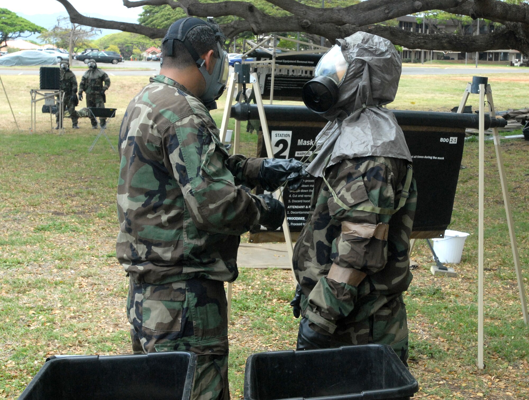 Hickam Airmen are evaluated on  ability to properly process through a contamination control area, during the Ability To Survive and Operate portion of an exercise here. The exercise is in preparation for the upcoming Operational Readiness Inspection. (U.S. Air Force Photo/Senior Master Sgt. Russell Dodson.)