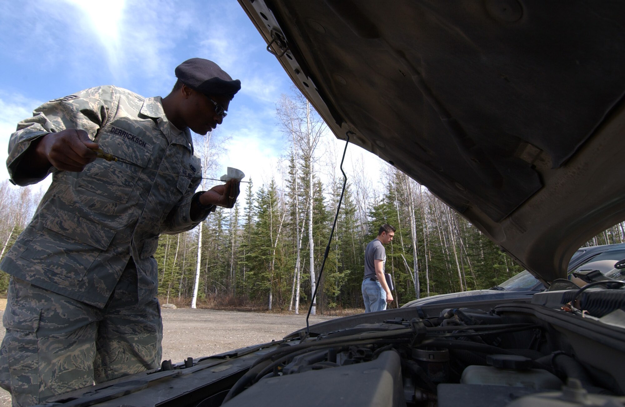 Senior Airman James Derrickson checks the fluid levels on a privately owen vehicle for a safety inspection May 12, 2008, at Eielson Air Force Base, Alaska during Police Week. Police Week is a week long event with demonstrations from the 354th Security Forces Squadron honoring those who are serving or have served in law enforcement. Airman Derrickson is assigned to the 354th SFS. (U.S. Air Force Photo/Airman 1st Class Jonathan Snyder)