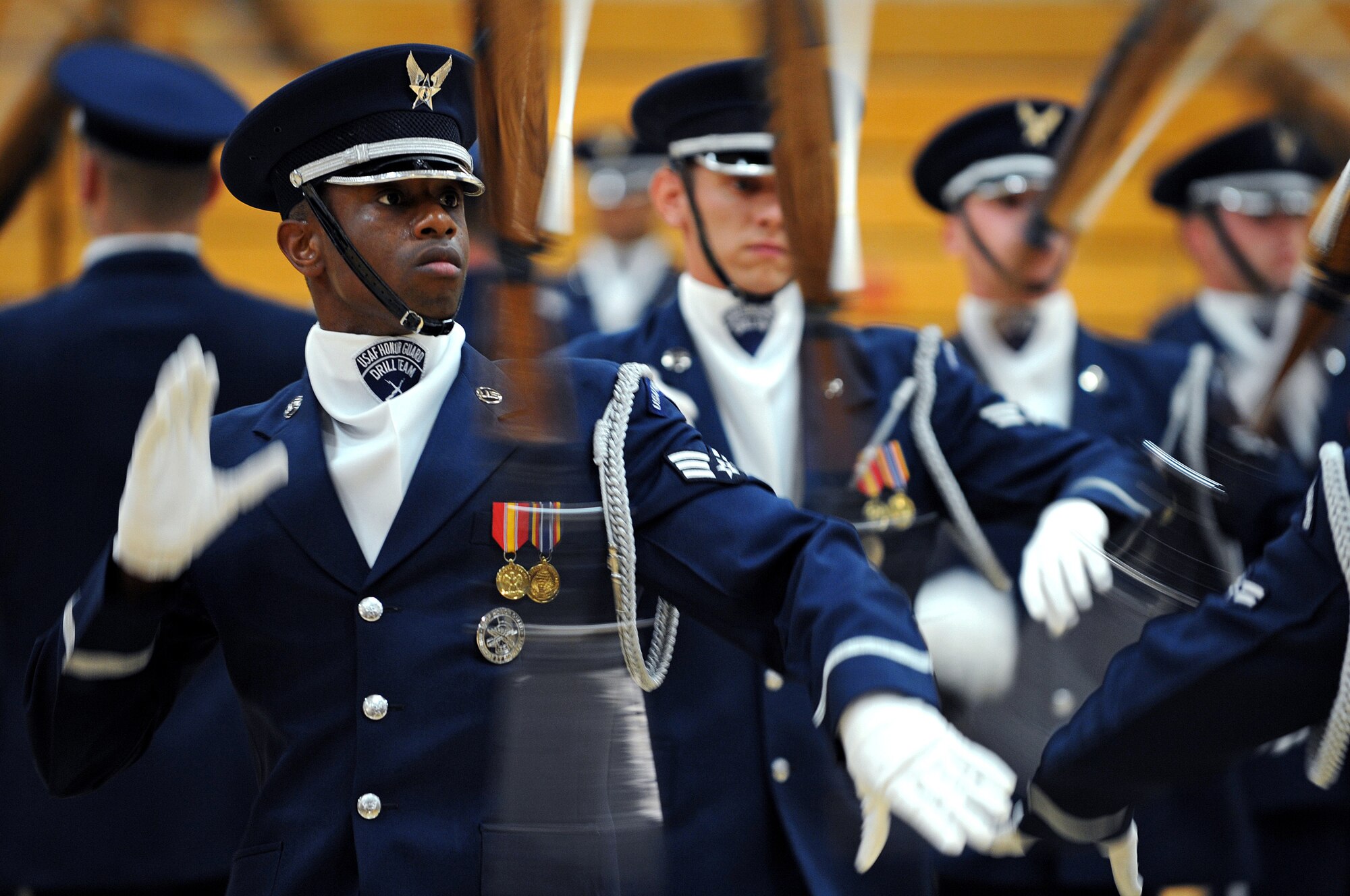 Senior Airman Michael Jiggetts, Air Force Honor Guard drill team member, spins a M-1 Garand rifle with fixed bayonet during a 16-man routine here, May 12. The Air Force Honor Guard Drill Team tours world-wide to public and military venues to recruit, retain and inspire Airmen. (U.S. Air Force photo/Senior Airman Marc I. Lane)
