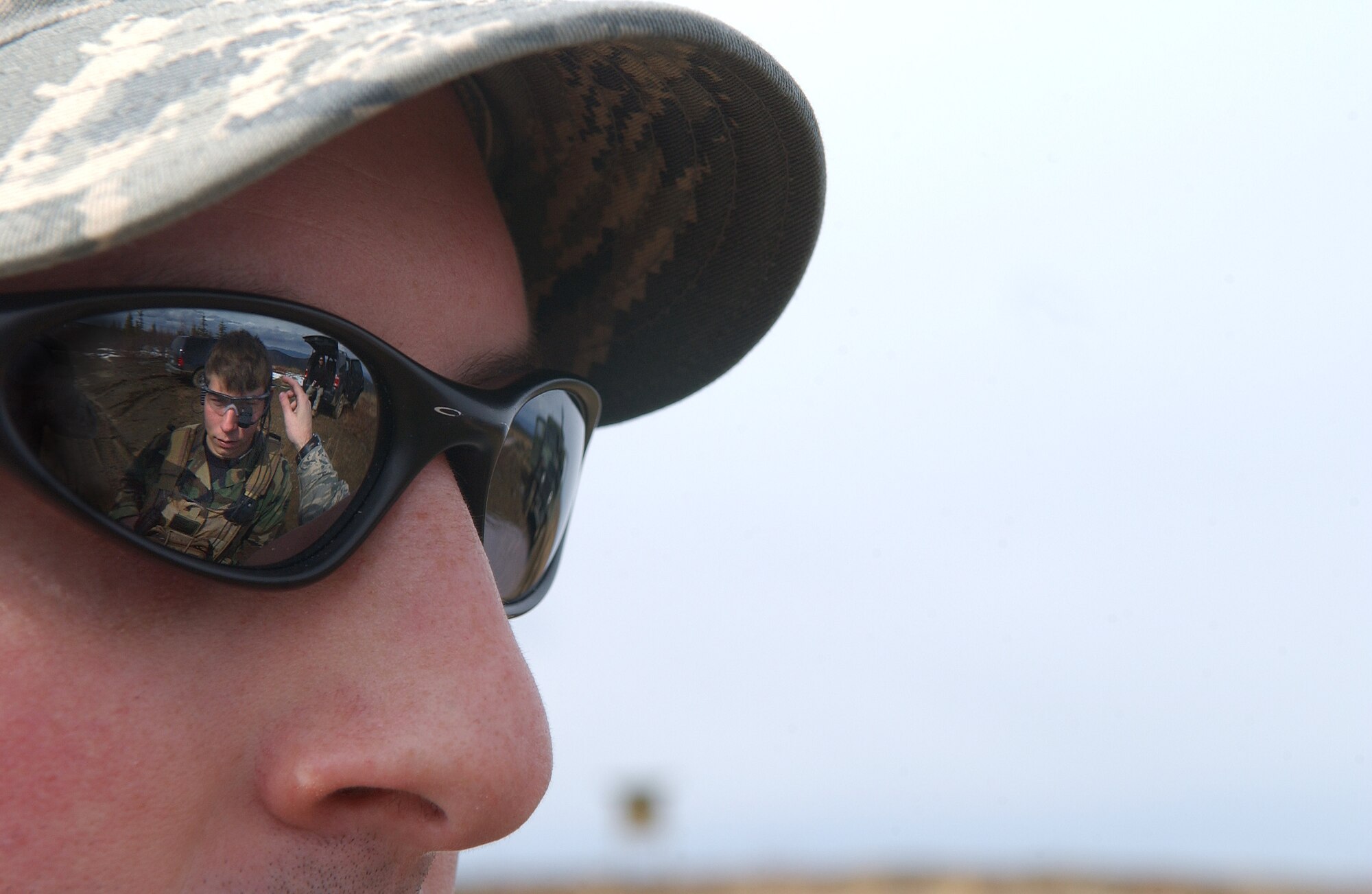 Gregory Burnett observes Senior Airman Nicholas Halladay use a new cocom-x communication equipment, which is one device that takes the place of three different radio systems, May 5, 2008, at Eielson Air Force Base, Alaska during Northern Edge 08 exercise. Tactical Air Control Party Airmen are helping test the new experimental equipment in the field. After several tests, they are providing feedback on how the equipment worked if any improvements could be made before the equipment will be used in combat situations years from now. Northern Edge is a joint training exercise hosted by Alaskan Command and is one of a series of U.S. Pacific Command exercises that prepare joint forces to respond to crises in the Asian Pacific region. Airman Halladay is a TACP assigned to Detachment 1, 3rd Air Support Operation Squadron from Fort Richardson, Alaska. Mr. Burnett is an Air Force Civilian from Wright-Patterson Air Force Base. (U.S. Air Force Photo/Airman 1st Class Jonathan Snyder)