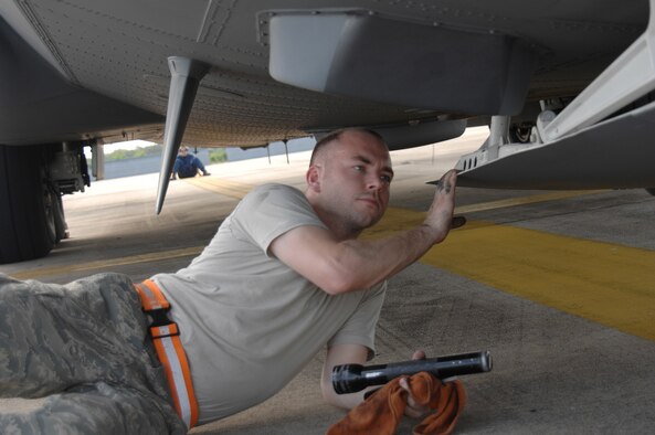 UTAPAO, Thailand - Staff Sgt. Michael Nardone, 374th Aircraft Maintenance Squadron of Yokota AB, Japan performs a pre-flight inspection on the exterior components of a C-130 Hercules in support of relief supplies being flown into Burma May 13. (USAF Photo/Senior Airman Sonya Croston)