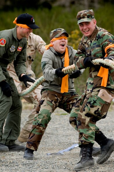 The orange team, led by Senior Airman Andrew Barry, 62nd Civil Engineer Squadron, participates in the tug-o-war portion of the competition.