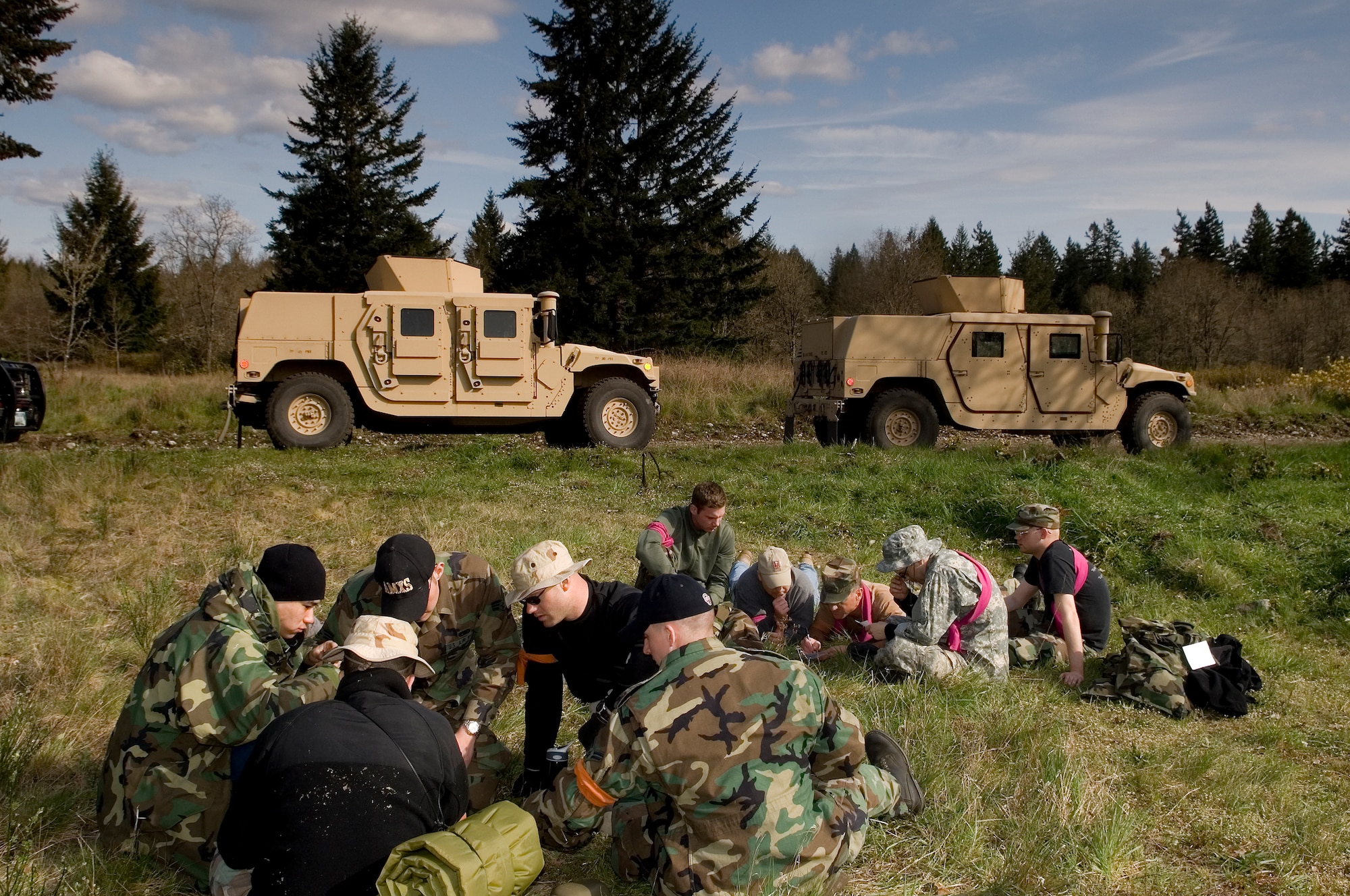 Teams attempt to unscramble a phrase during the translation frustration challenge May 1 as part of the Northwest Skunkworks event at the base’s South 40 training area.