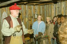 MINOT AIR FORCE BASE, N.D. -- Retired Air Force Maj. Richard L. Parrish, Fort Mandan blacksmith, teaches North Plains Elementary School fourth-grade students and teachers, May 8, how important the job of the blacksmith was to Lewis and Clark in Washburn, N.D. (Air Force photo by Airman 1st Class Jesse Lopez)