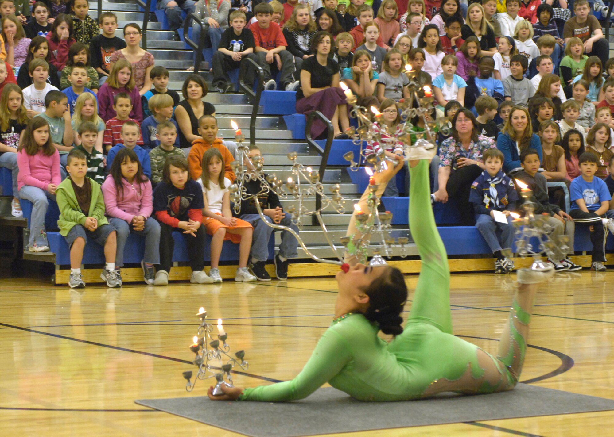 FAIRCHILD AIR FORCE BASE, Wash. – Chinese acrobat Lili Wu demonstrates her contortionist skills to the students at Michael Anderson Elementary school here May 13. A group of Chinese acrobats visited the school in celebration of their achievements in the school recycling contest. (U.S. Air Force photo / Airman 1st Class Melissa Barnett)