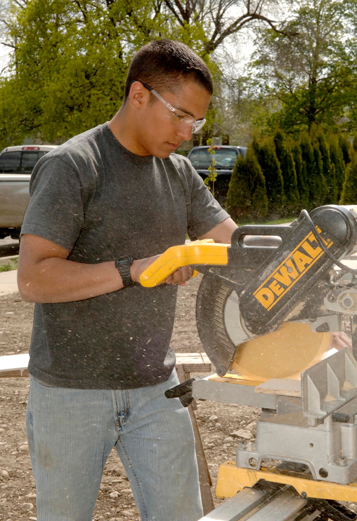 FAIRCHILD AIR FORCE BASE, Wash. – Airman 1st Class Courtney Bailey, 22nd Training Squadron, cuts wood in pre-measured segments to later be used as trim for the Habitat for Humanity homes in Spokane Valley, Wash. Habitat for Humanity has built more than 250,000 houses around the world, providing more than 1 million people in more than 3,000 communities with safe, decent, affordable shelter. (U.S. Air Force photo / Airman 1st Class Darlene West)