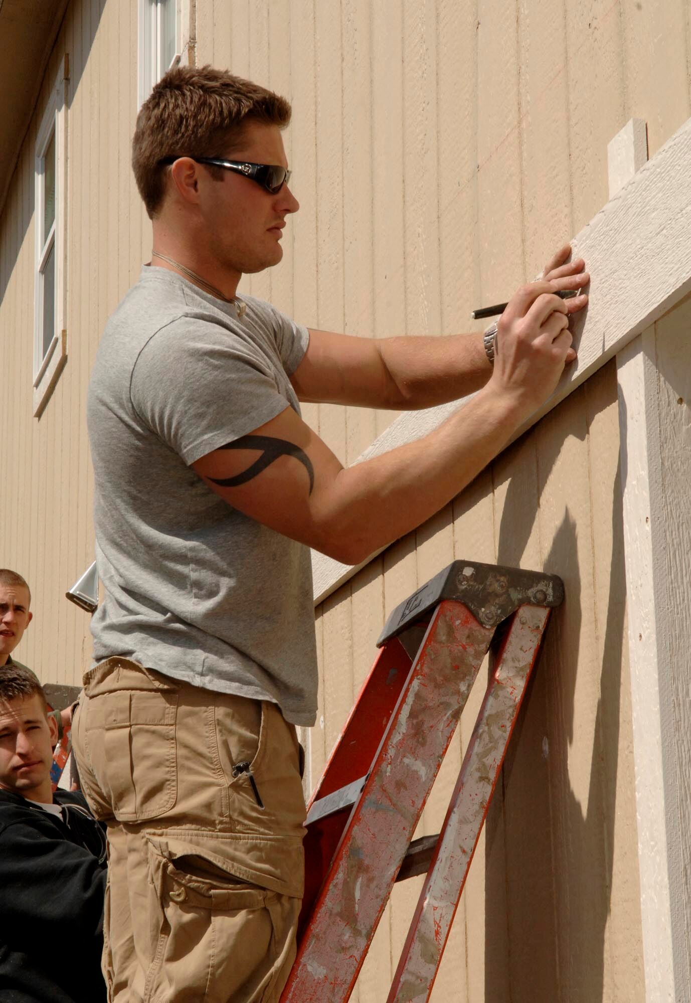 FAIRCHILD AIR FORCE BASE, Wash. – Airman 1st Class Lorin Schlecht, 22nd Training Squadron, volunteered with fellow squadron members to build a Habitat for Humanity home in Spokane Valley, Wash., May 8. Habitat for Humanity International is a nonprofit, ecumenical Christian housing ministry. (U.S. Air Force photo / Airman 1st Class Darlene West)