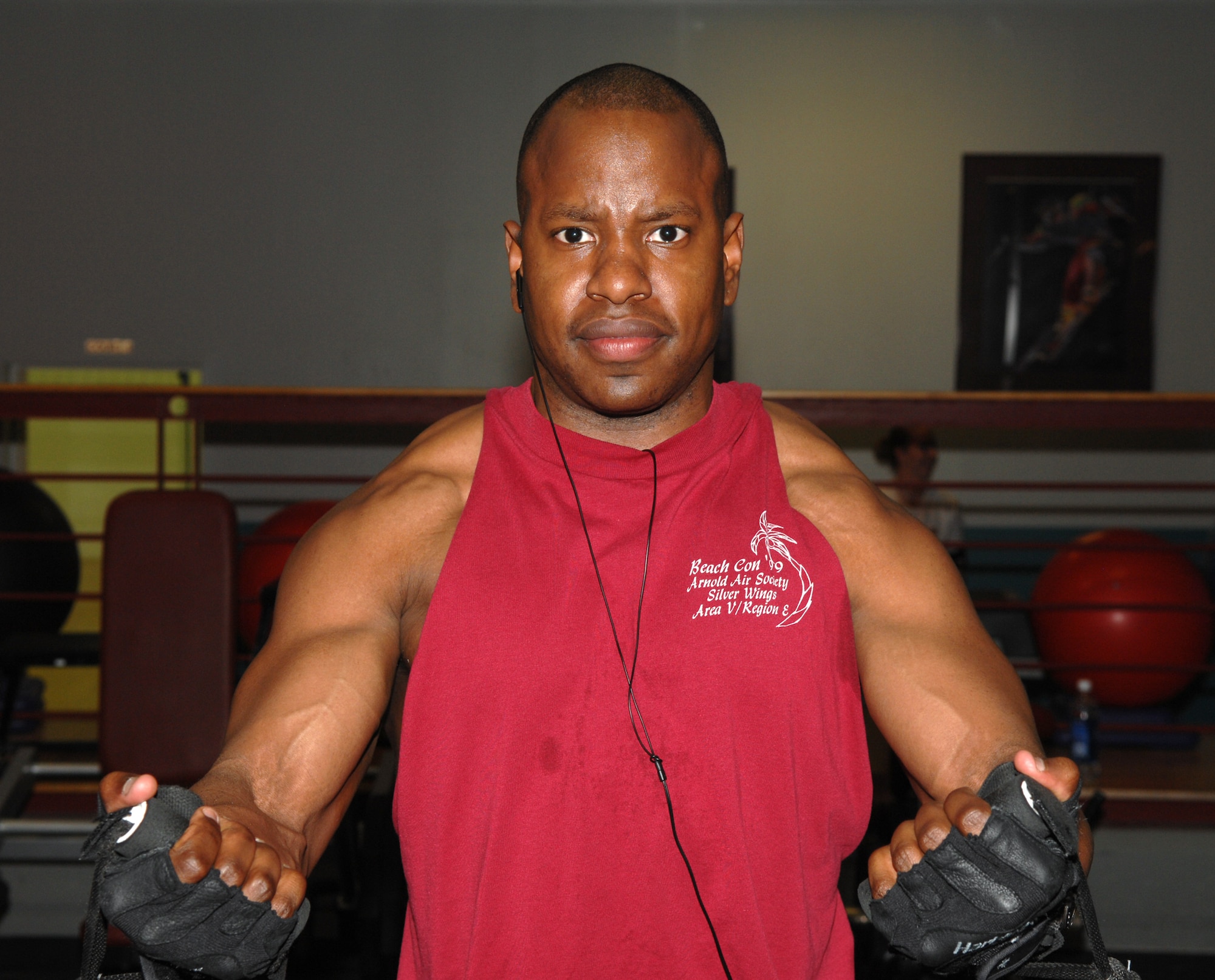 WHITEMAN AIR FORCE BASE, Mo. - Capt. Michael Boswell, 509th Logistics Readiness Squadron, works out works out his chest by performing a cross-over at the fitness center May 7. Capt. Boswell has lost more than 50 pounds in the last two years while becoming fit to fight. (U.S. Air Force photo/Airman 1st Class Stephen Linch)