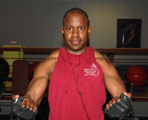 WHITEMAN AIR FORCE BASE, Mo. - Capt. Michael Boswell, 509th Logistics Readiness Squadron, works out works out his chest by performing a cross-over at the fitness center May 7. Capt. Boswell has lost more than 50 pounds in the last two years while becoming fit to fight. (U.S. Air Force photo/Airman 1st Class Stephen Linch)