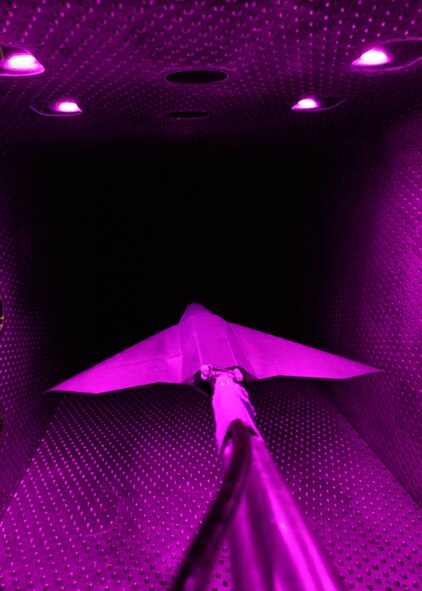 A one-eighteenth scale model of an Air Force tailless aircraft recently underwent aerodynamic testing in Arnold Engineering Development Center’s four-foot transonic wind tunnel. The test was a technology demonstration entry in which conventional methods and Pressure Sensitive Paint were used to compare the effectiveness of a jet effects spoiler with a solid spoiler in yaw and roll control and stability of the aircraft. (Photos by Rick Goodfriend)